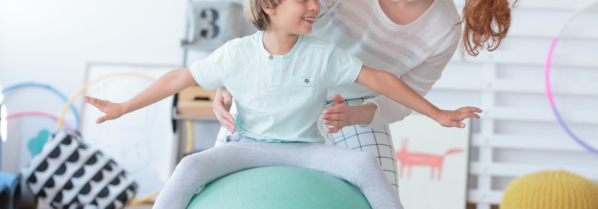Physical Therapist Assistant with a child patient